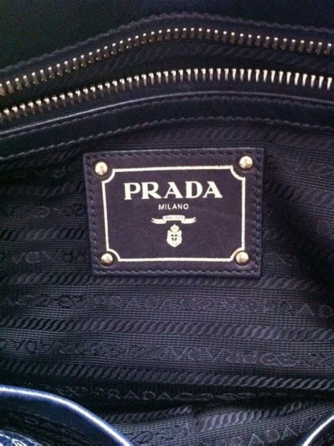 how to tell if a prada bag is real|prada authentic handbags guide.